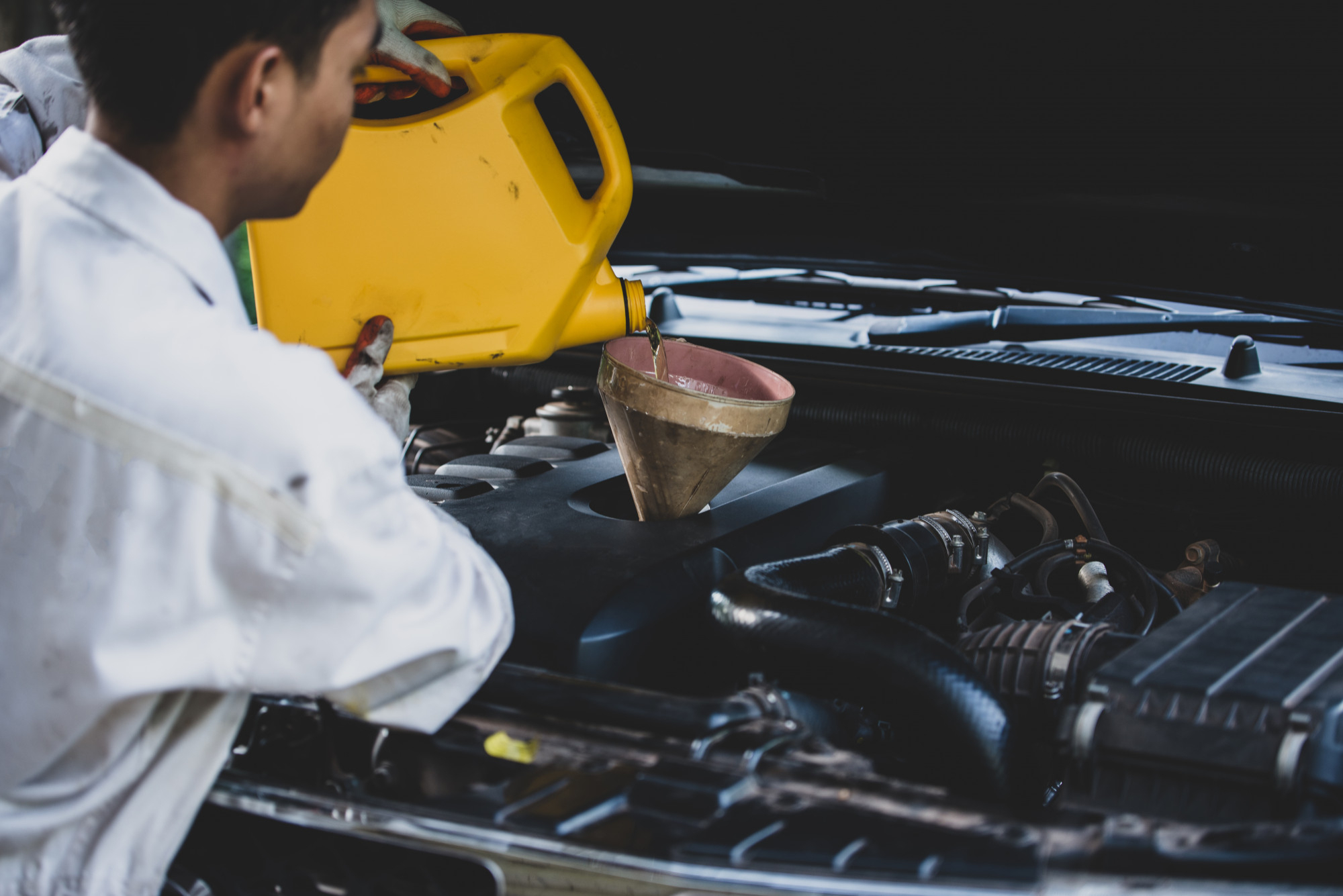 Coolant being poured into vehicle